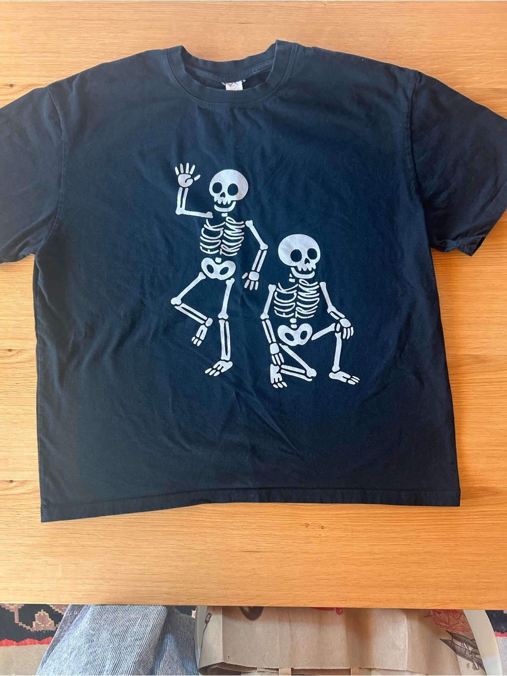 Black Tee with White Skeleton Ribs Graphic Political Statement